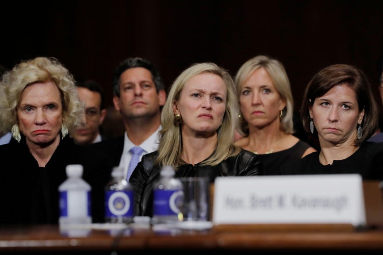 (L-R) Martha Kavanaugh, Laura Cox Kaplan, and Ashley Kavanaugh, listen as Judge Brett M. Kavanaugh testifies in front of the Senate Judiciary committee regarding sexual assault allegations at the Dirksen Senate Office Building on Capitol Hill on September 27, 2018 in washington,DC. - University professor Christine Blasey Ford, 51, told a tense Senate Judiciary Committee hearing that could make or break Kavanaugh's nomination she was '100 percent' certain he was the assailant and it was 'absolutely not' a case of mistaken identify. (Photo by JIM BOURG / POOL / AFP) (Photo credit should read JIM BOURG/AFP/Getty Images)